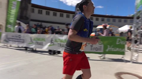 Determined runner pushes through fatigue during the final sprint to the finish Stock Footage 337897006