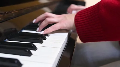 Determined student faces challenge of mastering piano technique, practicing with Stock Footage 305651644