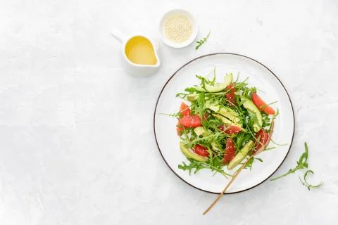 Detox grapefruit and arugula salad, top down view Stock Photos