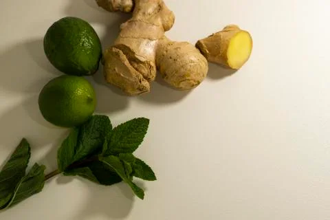 Detox tea supplement. Ginger root, mint and lime. Light background, copy space. Stock Photos