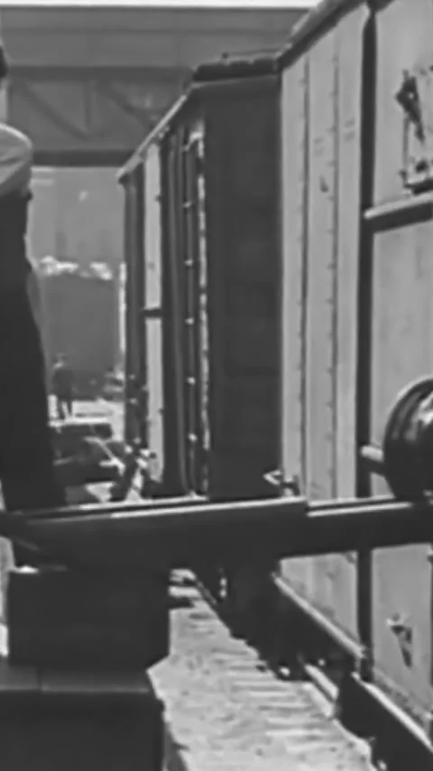 DETROIT - 1938 - Men work on an assembly line in a Ford manufacturing plant in Stock Footage 339105594