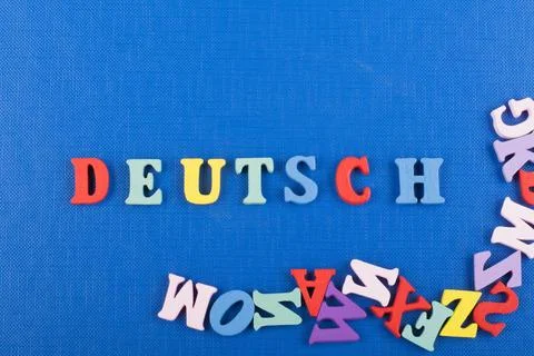 DEUTSCH word on blue background composed from colorful abc alphabet block woo Stock Photos