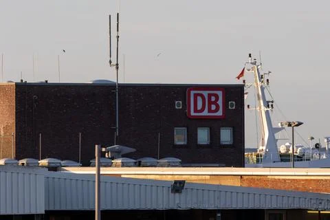 Deutsche bahn logo on building overlooking ferry mast Stock Photos