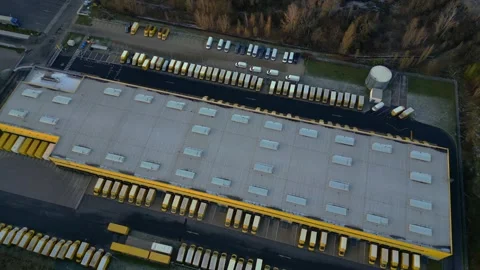 Deutsche Post logistics center with delivery vans. Magic aerial view drone Stock Footage 322929995