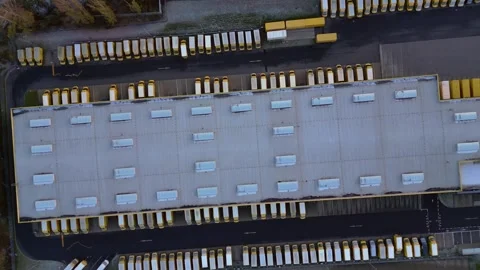 Deutsche Post logistics center with delivery vans. Lovely aerial view drone Stock Footage 322930015