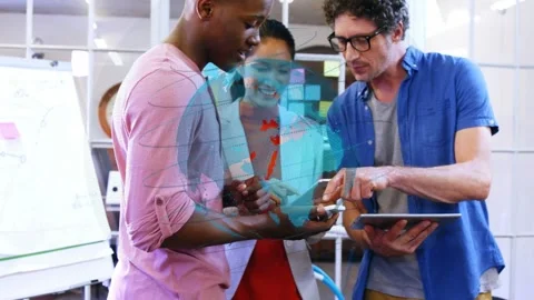 Dev pointing and designer tapping phone, starting holo globe moving over tablet Stock Footage 333397104