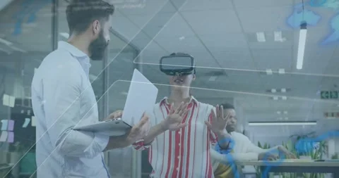 Dev putting on VR headset amid glass walls, testing hologram UI via gestures as Stock Footage 318499202