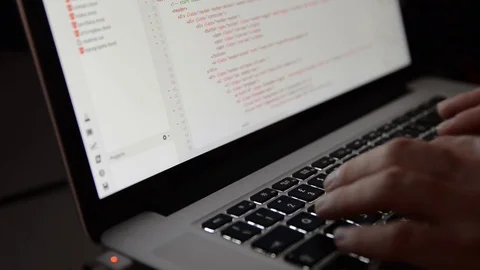 Dev rage Man's anger in front of a code programming screen Fist hitting keyboard Stock Footage 77630328