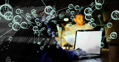 Dev typing on laptop, causing teal nodes overlaying figure and code forming map 스톡 사진