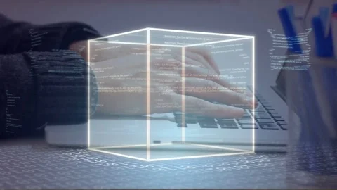 Dev typing on laptop, starting wireframe cube fading and rotating with scrolling Stock Footage 335732057