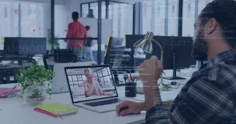 Dev watching laptop call while holding lamp, tech overlay on desk peer walking Stock Footage 334115717