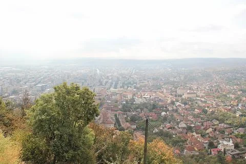 Deva, Romania - September 27 2019: Sunny Deva Town in Romania. Aerial City .. 스톡 사진
