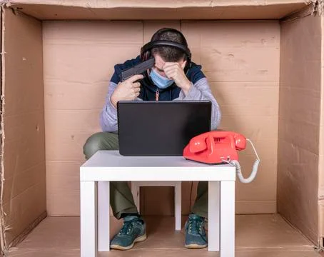 Devastated employee tries to commit suicide, burnout concept while working fr Stock Photos