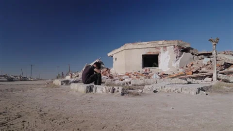 Devastated guy crying due to the destruction of his home. Devastated land Stock Footage 340297936