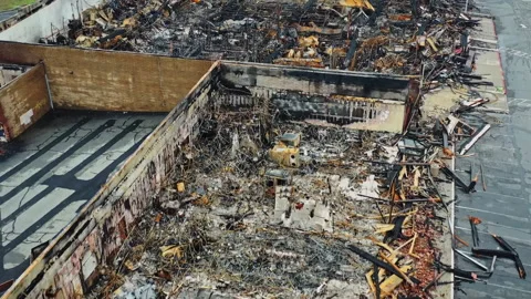 Devastating aftermath of a building fire aerial view 스톡 동영상 332960666