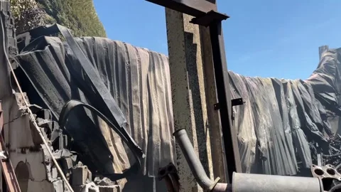 Devastating aftermath of a building fire with smoldering ruins Video stock 320815655