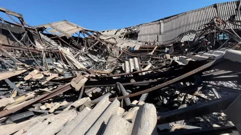 Devastating aftermath of a building fire with smoldering ruins Video stock 320815660