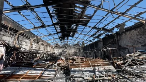 Devastating aftermath of a building fire with smoldering ruins Video stock 320815666