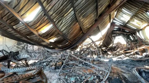 Devastating aftermath of a building fire with smoldering ruins Video stock 320815671