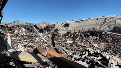 Devastating aftermath of a building fire with smoldering ruins Video stock 320815687