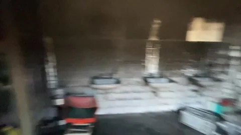 Devastating aftermath of a building fire with smoldering ruins Video stock 320815689