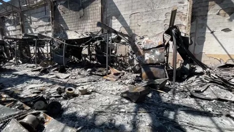 Devastating aftermath of a building fire with smoldering ruins Video stock 320815706