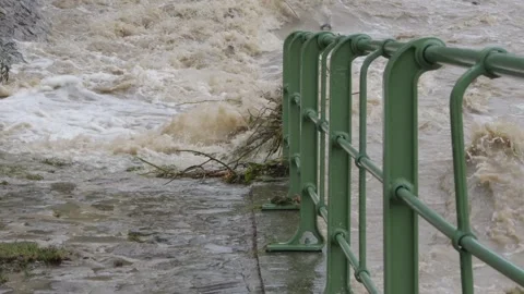 A devastating flood brings destruction and chaos to the riverbank Video stock 284733896
