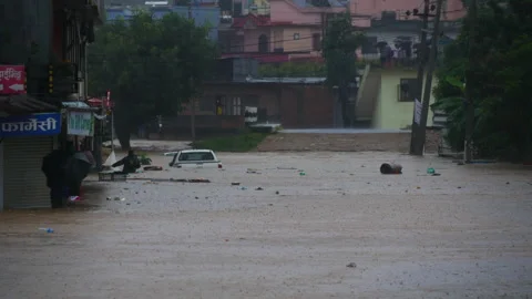Devastating Flooding in Kathmandu valley, vehicle, houses flooded with rain Stock Footage 286294504