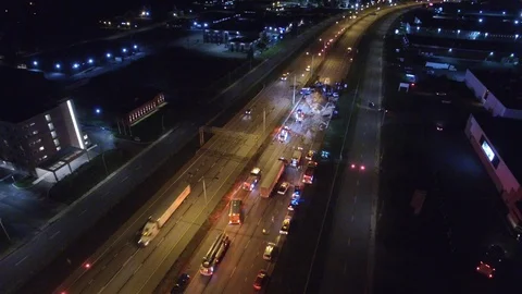 Devastating highway crash viewed by drone in flight at night Stock Footage 94386853