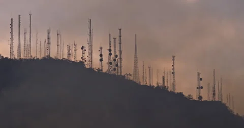 Devastating Wildfire: Antennas Amidst Smoke-Filled Hill Stock Footage 241018061