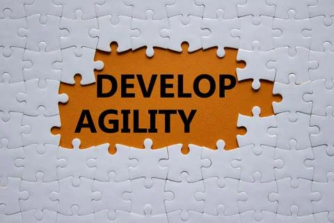 Develop agility symbol. Concept word Develop agility on white puzzle. Beaut.. 写真素材