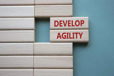 Develop agility symbol. Concept word Develop agility on wooden blocks. Beau.. 写真素材