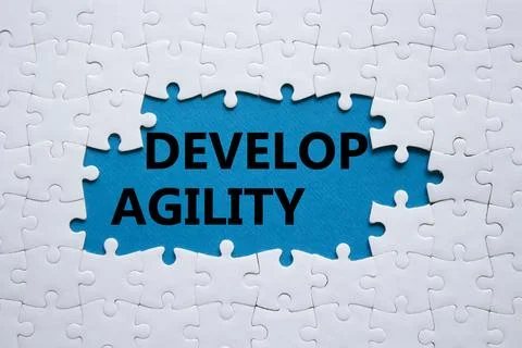 Develop agility symbol. Concept word Develop agility on white puzzle. Beaut.. 写真素材