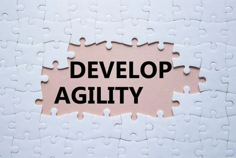 Develop agility symbol. Concept word Develop agility on white puzzle. Beaut.. Stockfoto's