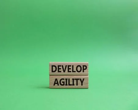 Develop agility symbol. Concept word Develop agility on wooden blocks. Beauti 写真素材