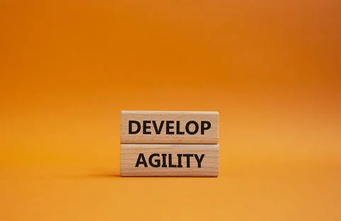 Develop agility symbol. Concept word Develop agility on wooden blocks. Beau.. 스톡 사진