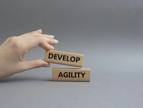 Develop agility symbol. Concept word Develop agility on wooden blocks. Beau.. 스톡 사진
