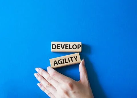 Develop agility symbol. Concept word Develop agility on wooden blocks. Beau.. Foto stock
