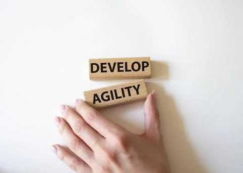 Develop agility symbol. Concept word Develop agility on wooden blocks. Beau.. 写真素材