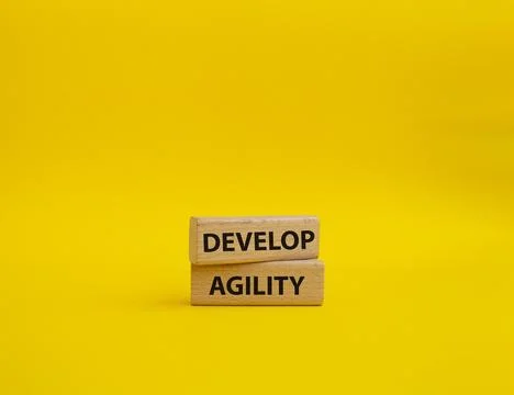 Develop agility symbol. Concept word Develop agility on wooden blocks. Beau.. 写真素材