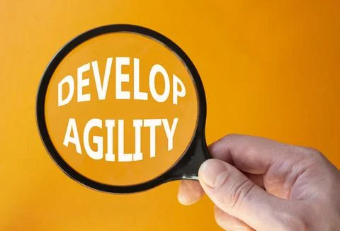 Develop agility symbol. Concept word Develop agility on magnifying glass. B.. 写真素材