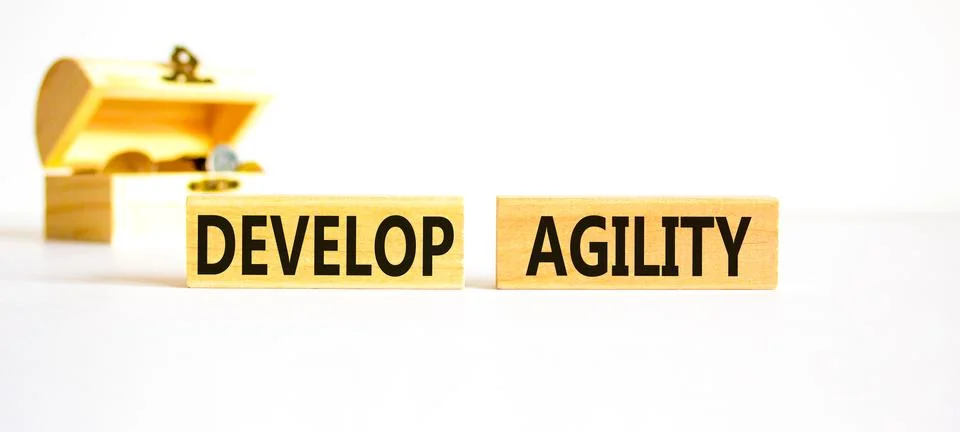 Develop agility symbol. Concept words Develop agility on wooden blocks on a.. Stock Photos