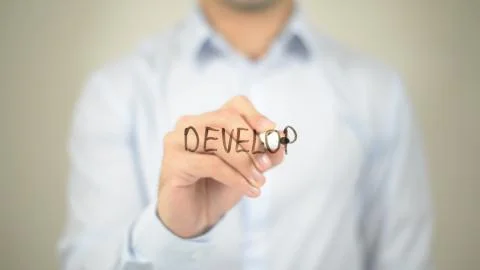 Develop, man writing on transparent screen Stock Photos