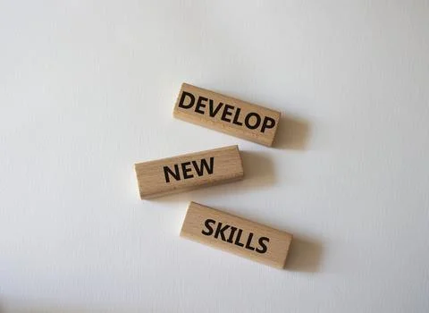 Develop New skills symbol. Concept word Develop New skills on wooden blocks.. Foto stock