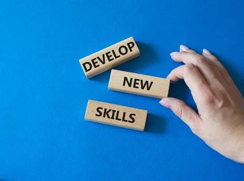 Develop New skills symbol. Concept word Develop New skills on wooden blocks.. Stock Photos