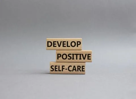 Develop positive self-care symbol. Concept words Develop positive self-care.. Stock Photos