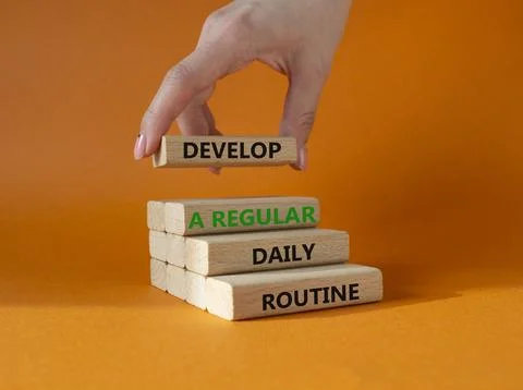 Develop a regular daily routine symbol. Concept words Develop a regular dai.. Stock Photos
