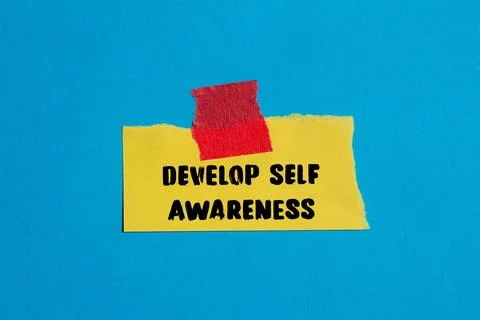 Develop self awareness message written on ripped torn paper background. Con.. Stock Photos