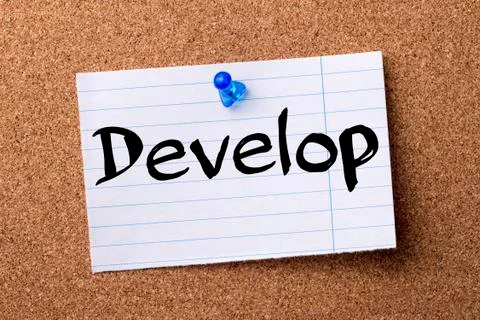 Develop - teared note paper  pinned on bulletin board Stock Photos