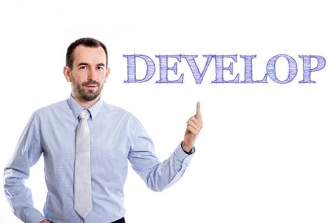 Develop - Young businessman with small beard pointing up in blue shirt Stock Photos